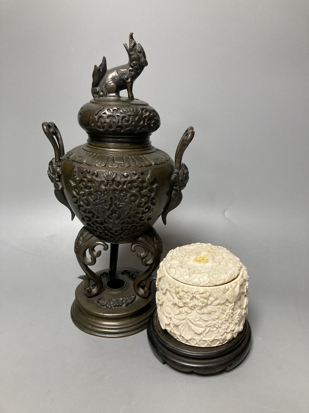 A Japanese ivory box and cover and a bronze koro and cover